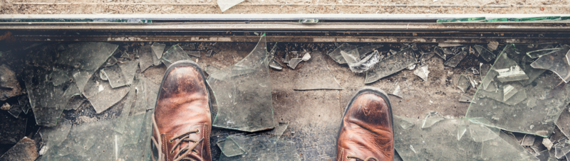 Staring down at shattered glass.